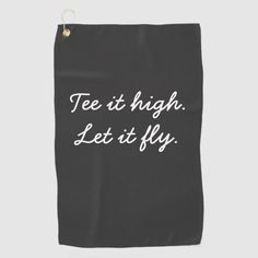 a black bag with white writing that says,'tee at high let it fly '