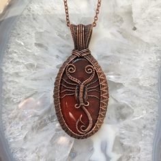 "This deep red jasper has been woven into an antique copper wire frame with a scorpion motif. This pendant comes with an 18\" clasped copper chain, gift packaging and free tracked shipping in North America. Scorpio Red Jasper and Woven Antique Copper Wire Wrapped Pendant Necklace" Red Jasper Pendant, Wrapping Stones, Wire Craft, Woven Necklace