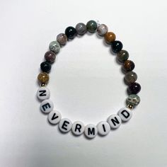 Nevermind bracelet made with 6 mm marine agate gemstones. Please note size:  5 - 5.5 inches small (kids)  6.5 standard  7.5-8.5 large/ men's sizes Nirvana Gift Ideas, Nirvana Bracelet, Alt Beaded Bracelets, Nirvana Beaded Bracelet, Mcr Bracelet Ideas, Slipknot Beaded Bracelet, 90s Gift, Music Bracelet, Goth Music