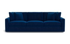 a blue couch with four pillows on it's back and one arm facing the camera