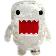 a small plastic toy with a red mouth and teeth on it's face, standing in front of a white background