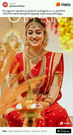 a woman in red and gold sitting down