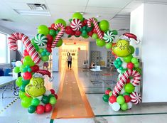 the balloon arch is decorated with candy canes and dr seusselu's