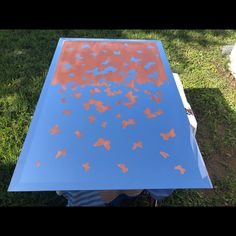 a blue table with red butterflies on it