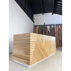 a large wooden box sitting in the middle of a room