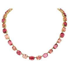 Victorian style Riviere tourmaline necklace with beautiful gem quality red, peach and pink oval stones total weight 64 Carats, set in yellow gold entirely handmade in 18K. This is a modern take on the classic Victorian Riviere necklace.. Necklace can be made in any color gold for a special order. Each stone is handpicked by myself, a gemologist to ensure that each color stone matches the next! Exquisite craftsmanship and detail throughout! Pink Tourmaline Necklace, Riviere Necklace, Victorian Modern, Amethyst Set, Red Peach, Tanzanite Diamond, Fringe Necklace, Tourmaline Necklace, Tourmaline Stone