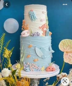 a three tiered cake decorated with sea life