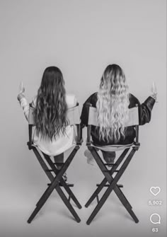 two women sitting in chairs facing each other