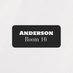 the room 16 sign is black and white