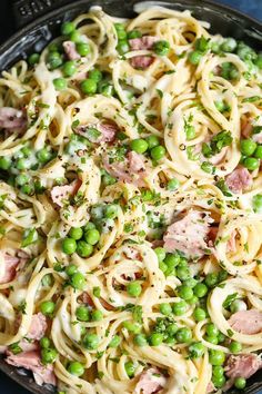 pasta with peas and ham in a skillet