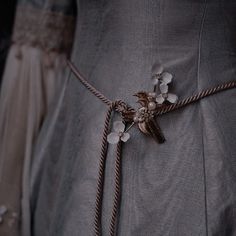 a close up of a dress with flowers on it