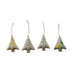 three small christmas trees hanging from strings