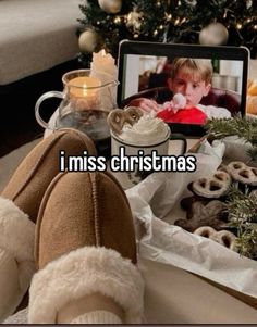 someone is sitting in front of their laptop with the caption i miss christmas