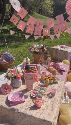 an outdoor birthday party with food and decorations