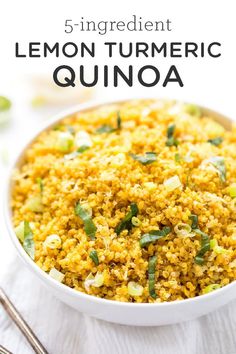 lemon turmeric quinoa in a white bowl with spoons on the side