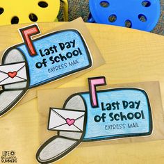 two mail boxes with the words last day of school written on them sitting on top of a table