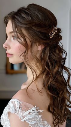 a woman with long hair wearing a wedding dress