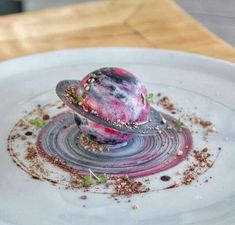 a white plate topped with food on top of a wooden table