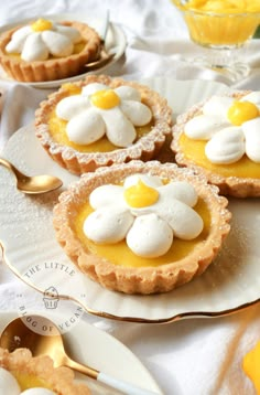 small pies with white and yellow toppings on plates