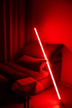 a red light is shining on a couch