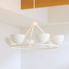 a white chandelier hanging from the ceiling