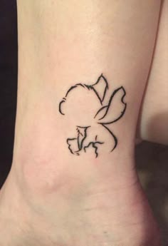 a small flower tattoo on the ankle is shown in black and grey ink, with an arrow