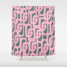 a pink and grey shower curtain with circles on it