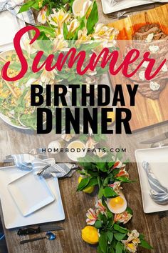 a wooden table topped with plates covered in flowers and greenery next to a bowl of food