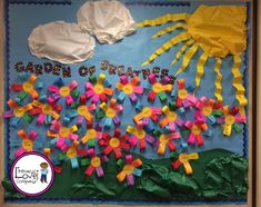 a bulletin board decorated with paper flowers and the words garden of letters written on it