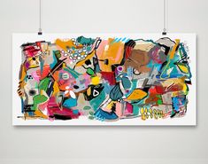 an abstract painting on a white wall with hanging hooks in front of it and the image is