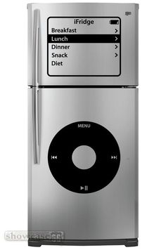 a silver refrigerator freezer sitting on top of a white floor next to an ipod