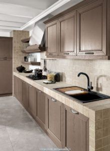 a kitchen with brown cabinets and marble counter tops is pictured in this image, there are no people or objects on the counter