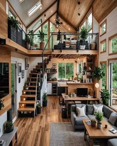 a living room filled with lots of furniture and wooden flooring next to a stair case