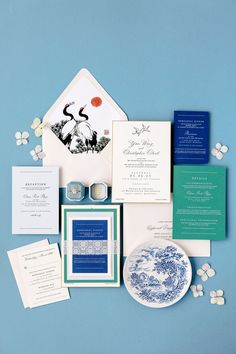 the wedding stationery is laid out neatly on top of each other, including an envelope