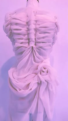 the back of a mannequin's dress with ruffles on it