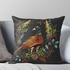 a pheasant sitting on a holly wreath throw pillow