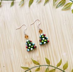 I T E M * D E S C R I P T I O N  🎄Cute mini christmas tree dangle earrings  -925 sterling silver hypoallergenic hooks  -1 inch drop length  -a perfect gift for a secret santa, coworker, or mom! ---------------------------------------------- Check out our other earrings here:  https://needfulthingsthrift.etsy.com?section_id=46781030 Check out our homepage here:  https://needfulthingsthrift.etsy.com M A T E R I A L S lampwork bead christmas trees, 925 sterling earring hooks, rubber backs for backs of earring hooks Please note, this item is handmade and may be slightly different each time it is made, But I assure that it is very close to what you see in photos All jewelry is handmade with love, designed and created by us. We are lovers of jewelry and fashion, that is why we put so much effor Santa Stocking, Handmade Jewelry Earrings, Christmas Tree Earrings, Bead Pendant, Holiday Trends, Mini Christmas Tree, Mini Christmas, Holiday Earring, Earring Tree