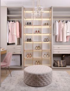 a walk in closet with white shelves filled with shoes and pink accessories on hangers