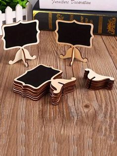 several pieces of wood sitting on top of a wooden table next to a blackboard