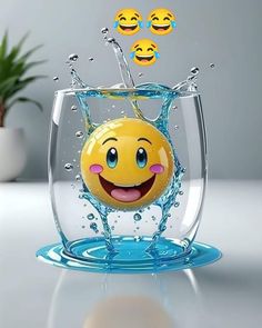 a yellow smiley face in a fish bowl with water splashing around it and three blue bubbles