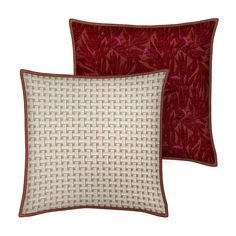 two red and white pillows with birds on them