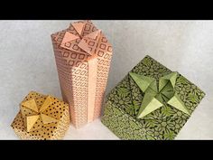 three origami boxes sitting next to each other