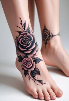 a close up of a person's foot with tattoos on it and roses around the ankles