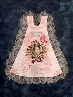 a dress made out of doily with an image of a woman's face on it