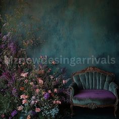 a chair sitting next to a bunch of flowers in front of a wall with green paint