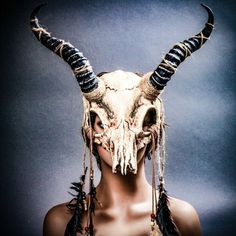 This Antelope Animal Skull Mask With Impala Horns Is Made From Plastic, Then Decorated And Hand Painted To Give It An Beautiful Aged Texture Look. The Mask Is About 16″ Tall And 16″ Wide. The Masquerade Mask Will Make A Great Costume Accessory. Product Feature Made From Plastic With Paper Molding And Hand Painted. Great For A Masquerade Ball, Venetian Costume, Halloween Costume Features Mythological Beasts May Also Be Used As A Display Piece Hand Painted With An Unique Texture Finish Bone Mask, Animal Skull Masks, Deer Skull Mask, Fantasy Horned Masquerade Mask For Costume, Horned Mask, Animal Skull Mask, Masquerade Mask With Horns, Masquerade Mask Animal, Horned Masquerade Mask