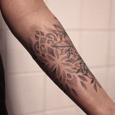 a person with a tattoo on their arm