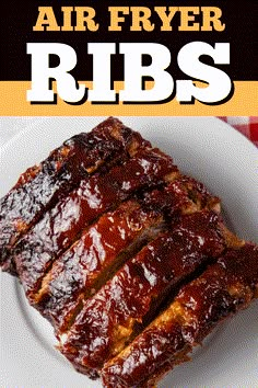 ribs on a white plate with the words air fryer ribs above it and an orange background