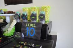 a table topped with lots of candy and candies on top of a black counter