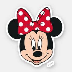 a minnie mouse sticker with a red bow on it's head and polka dots